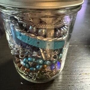 Assorted Beaded Jewelry in Jar